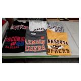 Various college football t-shirts, all are larger