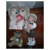 Porcelain doll and stuffed bears.