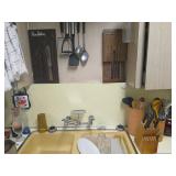 Everything pictured, utensils, knives, and more.