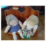 2 dolls with wooden bench, 24'  wide, 23' tall.