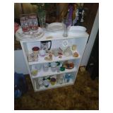 White shelf and contents, Coke glasses more.