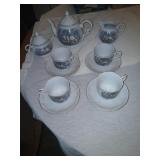Teapot, 4 cups saucers Creamer sugar 2 bread