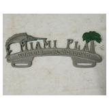 Miami world playground license plate topper.