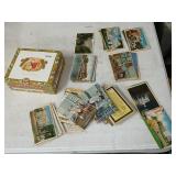 100 plus postcard, many unused in cigar box.