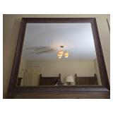 Wood framed wall mirror