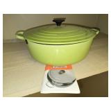 Green Le Creuset cast iron pot with lid