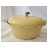 Yellow cast iron enamelware pot with lid
