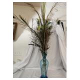 Blue glass vase with faux peacock feathers