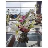 Decorative footed vase with faux flowers
