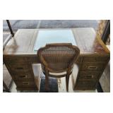 Large wooden desk with chair