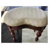 Wooden upholstered kidney shaped ottoman