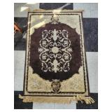 Tan and brown decorative rug