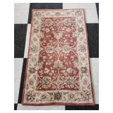 Red and tan decorative rug