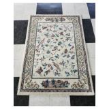 Tan floral themed rug