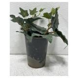 Antique metal flower pot with artificial ivy