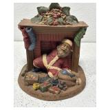 Signed Tom Clark pecan resin figurine. Has chip.