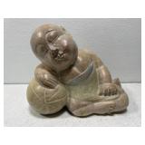 Hand carved wooden Asian boy sleeping