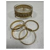 Glass trinket bowl with gold tone bottom & bangles