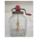 Vintage glass jar with butter churn attachment