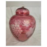 Cranberry color etched glass urn