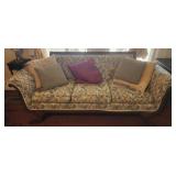 Wooden upholstered footed couch