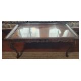 Wooden coffee table with glass top