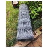 Large roll of metal fencing