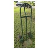 Green metal hand truck both tires are flat