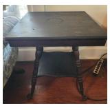 Wooden side table with claw feet