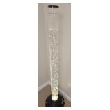 Tall plastic bubbling water tower