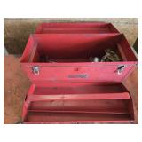 Red metal toolbox with tools