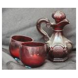 Cranberry glass perfume bottles and two cups