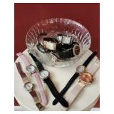 Lot of stylish watches in a bowl