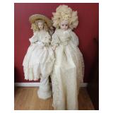 2 porcelain dolls with very long dresses