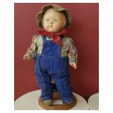 Vintage composition doll dressed in overalls