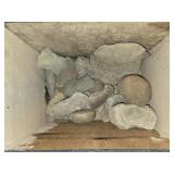 Vintage wood box of odd shaped rocks