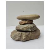 Native artifacts stacking rocks