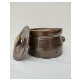 Antique clay pot with lid filled with antique
