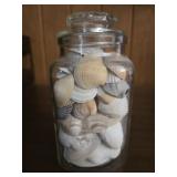 Glass jar full of sea shells