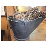 Coal bucket with pine cones