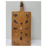 Arrowheads on a decorative cutting board