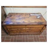 Wood chest full of linens