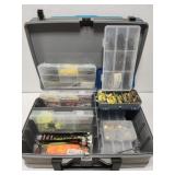 Plano box with assorted fishing lures and hooks