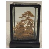 Hand carved cork diorama in case
