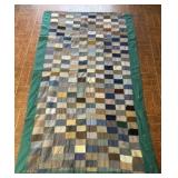 Green and blue hand sewn quilt