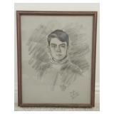 Framed charcoal or graphite portrait of a person