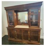 Vintage wooden hutch with a mirrored back panel
