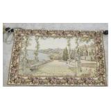 Vintage woven wall tapestry depicting a " T