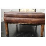 Square brown leather ottoman with nailhead trim
