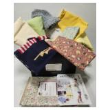 Box full of fabrics and more
